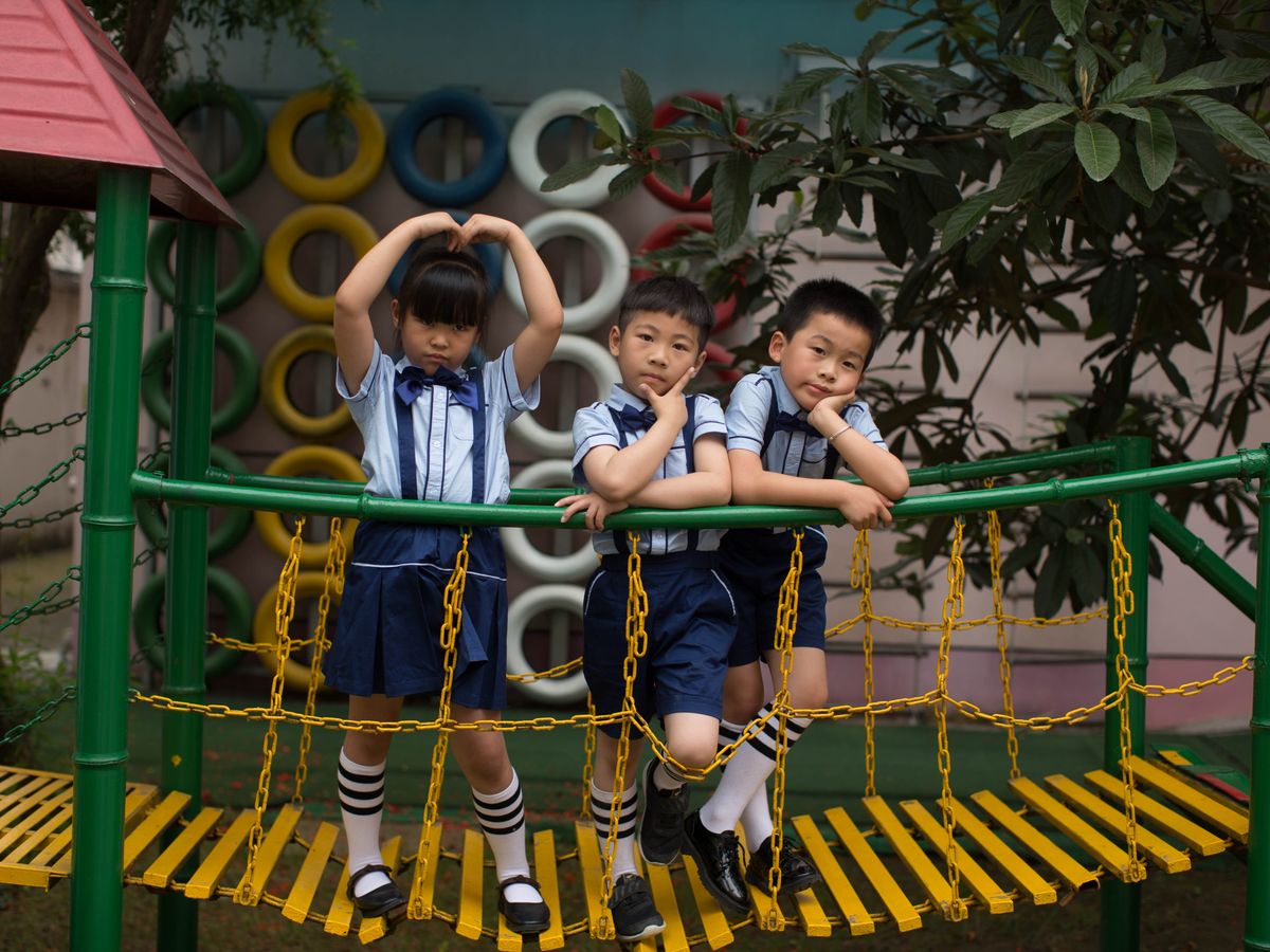 Children playing happily on a colourful school playground